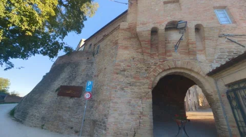 Ancient medieval gate made of brick and stone with large entrance arch Vídeos de archivo 346767794