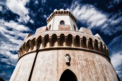 Ancient medieval tower, cloudy blue sky (Castle of Corigliano Calabro) Stock Photos