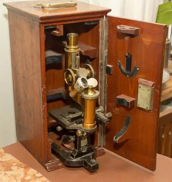 Ancient microscope in a wooden box Stock Photos