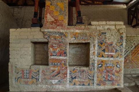 Ancient Moche polychrome murals with stylized mythological figures and geometric Stock Photos
