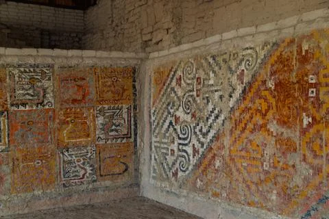 Ancient Moche polychrome murals with stylized animal figures and geometric patte Stock Photos