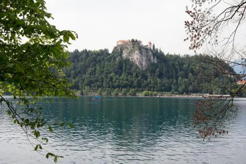 Ancient monastery on a cliff surrounded by lake bled. Stock Photos