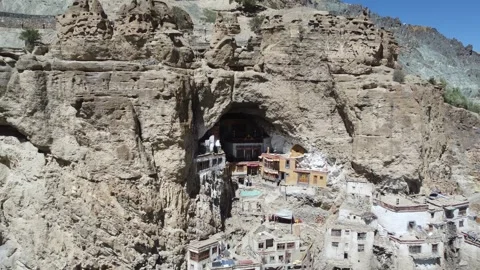 Ancient Monastery Nestled in Rocky Cliffs of Himalayas, Ladakh, with colorf.. Stock-Footage 345730998