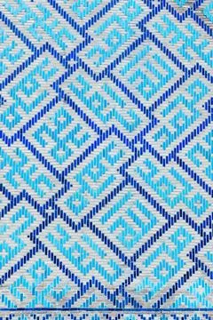 Ancient mosaic wall with Arabic pattern, blue geometric decoration Stock Photos