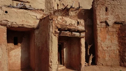 Ancient mud brick adobe buildings with wooden beams 動画素材 347973249