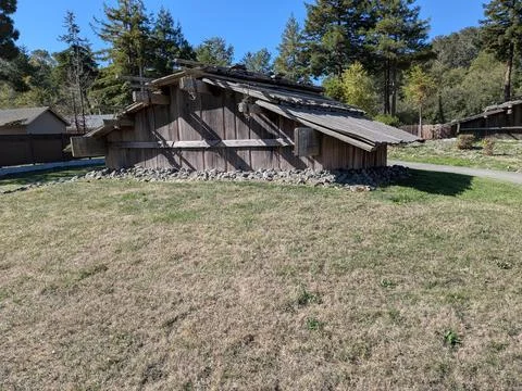 Ancient Native American house built low to the ground without windows Stock Photos
