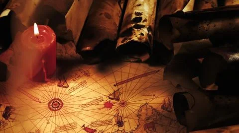 Ancient Nautical Map Lit By Burning Red Candle With Old Paper Scrolls Stock Photos