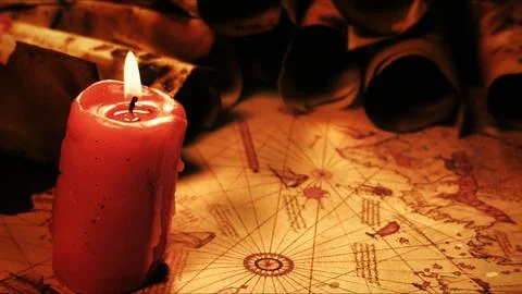 Ancient Nautical Map Lit By Burning Red Candle With Old Paper Scrolls Stock Photos