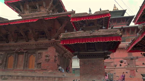 Ancient Newar Pagoda Temples and Flying Pigeons in Durbar Square Stock Footage 336037510