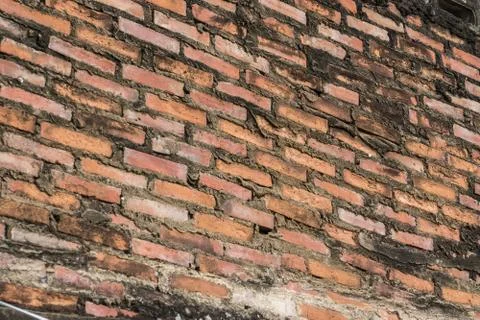 Ancient old brick wall red grunge surface with weathered cement texture backg Stock Photos