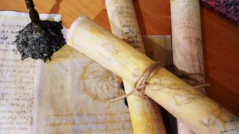 Ancient parchment, bound by time. Aged scrolls. Manuscripts, ancient papers Stock Footage 288703045
