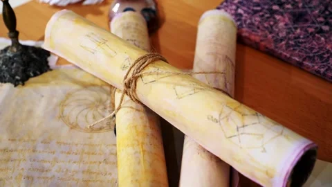 Ancient parchment, bound by time. Aged scrolls. Manuscripts, ancient papers Stock Footage 288703193
