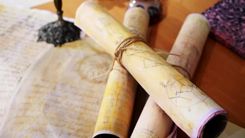 Ancient parchment, bound by time. Aged scrolls. Manuscripts, ancient papers Stock Footage 288703300