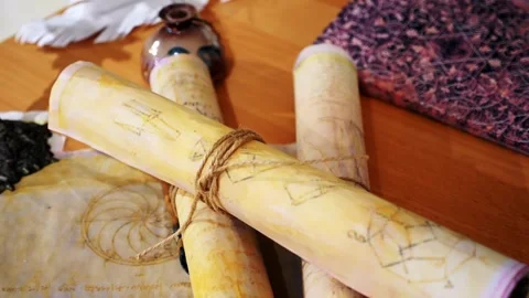 Ancient parchment, bound by time. Aged scrolls. Manuscripts, ancient papers Stock Footage 288703369