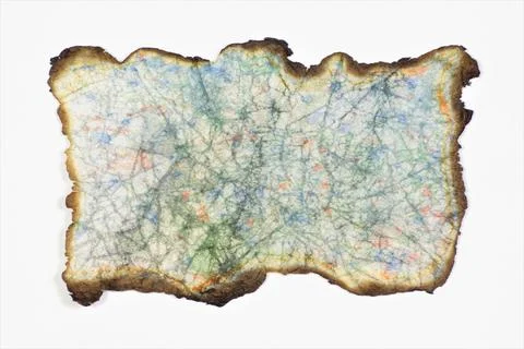Ancient parchment with burnt edges. Stock Photos