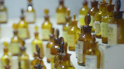 Ancient parfum flacons lined up in a museum Video stock 237743869