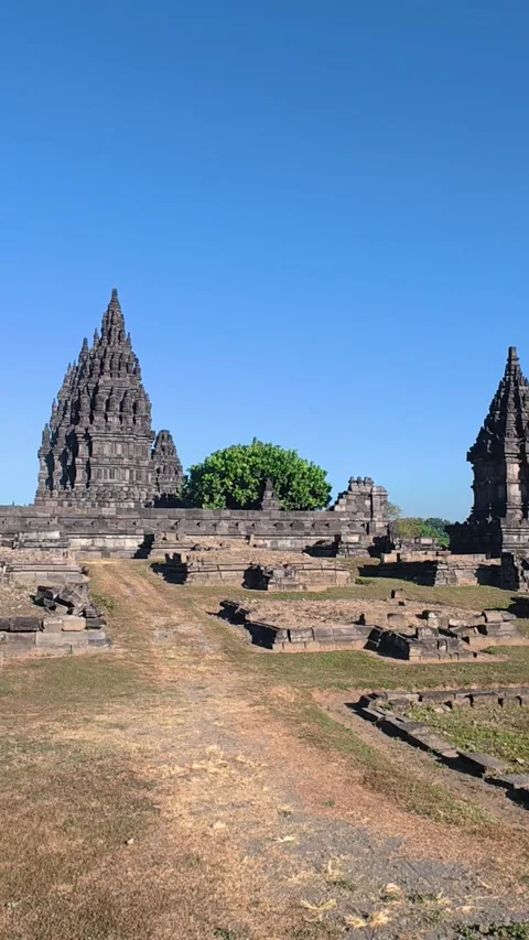 Ancient pathways and stone foundations lead toward the towering spires of t.. Stock Footage 341543025