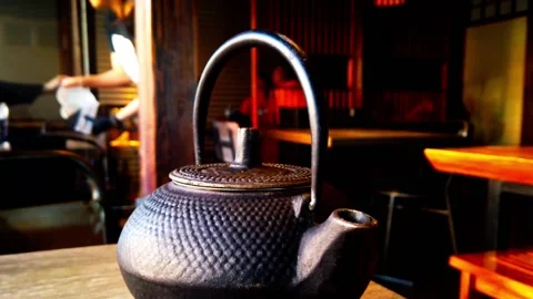 Ancient Pattern Black Cast Iron Teapot Japanese Tetsubin Tea Set for Wood Stock Footage 209921370
