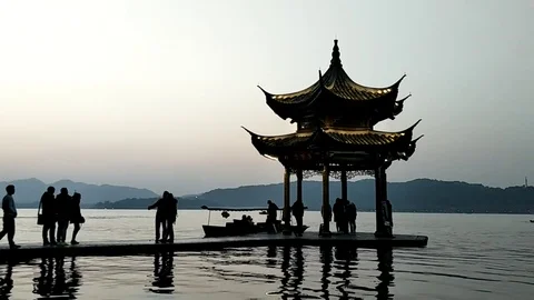 Ancient pavilion in lake at twilight Stock Footage 71048374