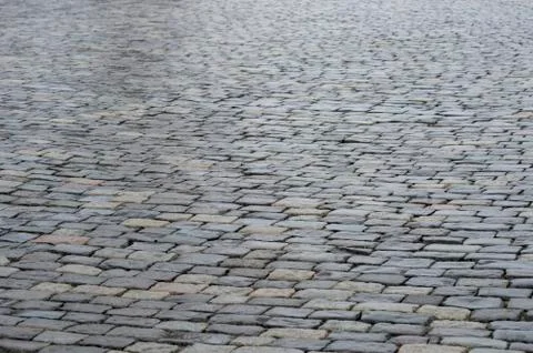 Ancient paving stones made of rectangular stone bricks. Textured background 스톡 사진