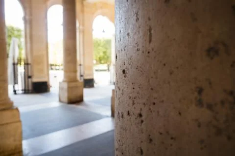 Ancient pillar of access to a park in the streets of Paris Stock Photos