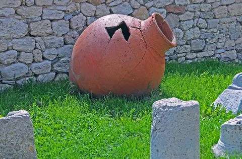 Ancient pithos on the grass Stock Photos