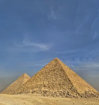 Ancient pyramids under a clear blue sky Stock Photos