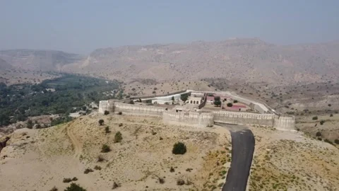 Ancient Ranikot Fort reveals massive walls across a rugged mountain landscape 스톡 동영상 345717252