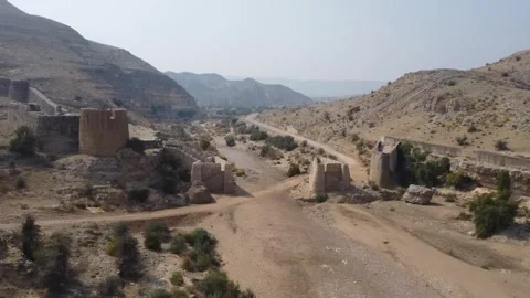 Ancient Ranikot Fort reveals massive walls across a rugged mountain landscape 스톡 동영상 345717356