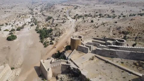 Ancient Ranikot Fort reveals massive walls across a rugged mountain landscape 스톡 동영상 345717359