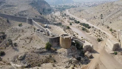Ancient Ranikot Fort reveals massive walls across a rugged mountain landscape 스톡 동영상 345717409