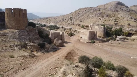 Ancient Ranikot Fort reveals massive walls across a rugged mountain landscape 스톡 동영상 345717411