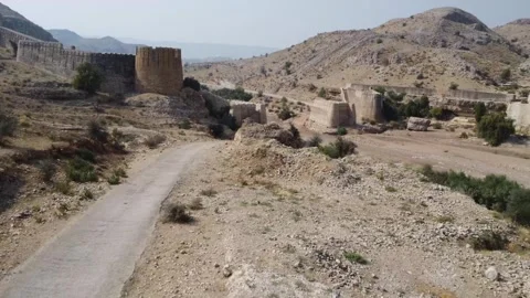Ancient Ranikot Fort reveals massive walls across a rugged mountain landscape 스톡 동영상 345717438