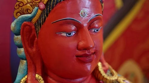 Ancient red buddhist statue - Buddha - tilt Stock Footage 80001372