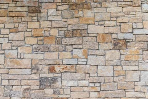 Ancient red stone wall flat background closeup Stock Photos