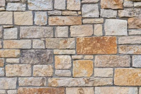 Ancient red stone wall flat background closeup Stock Photos