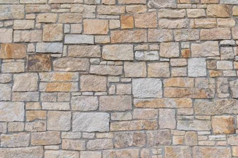 Ancient red stone wall flat background closeup Stock Photos