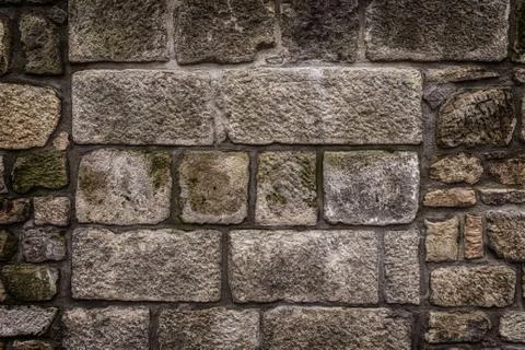 Ancient red stone wall flat background closeup Stock Photos