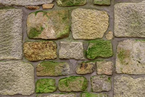 Ancient red stone wall flat background closeup Stock Photos
