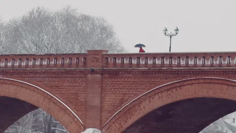 Ancient restored red brick bridge in Kuldiga Stock Footage 245959892