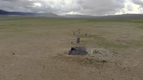 Ancient ritual burial site with deer stones - Historic Monument and Open Steppe Stock Footage 339700331