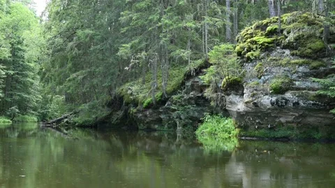 The  ancient river flows quietly, background sandstone outcrops 動画素材 138248664