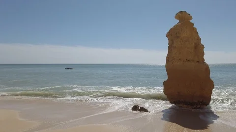 Ancient rock along ocean Stock Footage