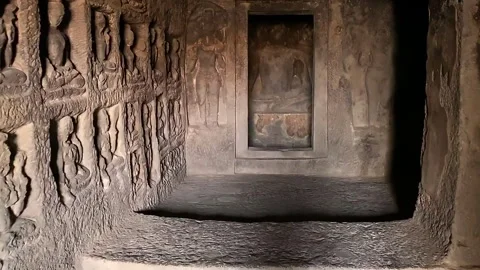 Ancient rock-cut cave interior with carved walls Stock Footage 301303523