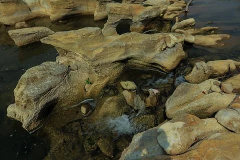 Ancient Rock Formations by a Riverbed Stock Photos