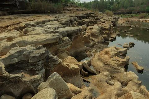 Ancient Rock Formations by a Riverbed Stock Photos