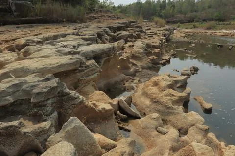 Ancient Rock Formations by a Riverbed Stock Photos