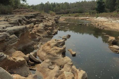 Ancient Rock Formations by a Riverbed Stock Photos