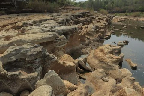 Ancient Rock Formations by a Riverbed Stock Photos