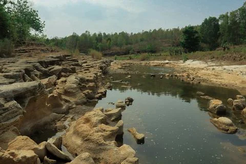 Ancient Rock Formations by a Riverbed Stock Photos